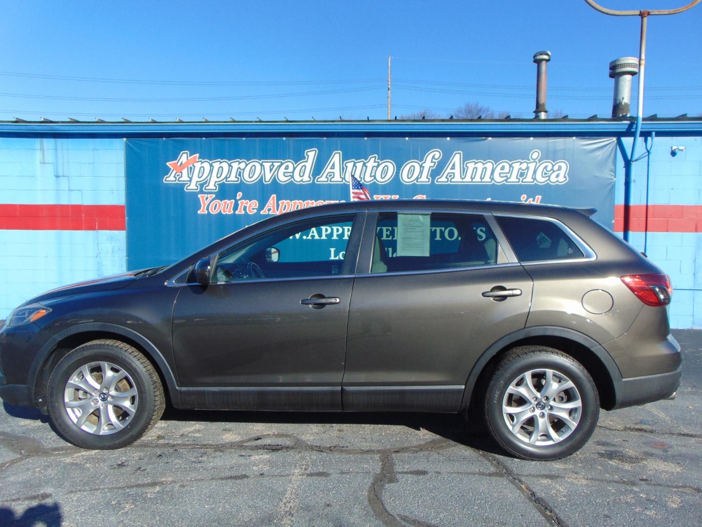 2015 Black MAZDA CX-9 (JM3TB3CA7F0) with an V6 3.7 Liter engine, Auto, 6-Spd Sportshift transmission, located at 2105 Dixie Hwy, Louisville, KY, 40210, (502) 772-3333, 38.220932, -85.795441 - Photo#0